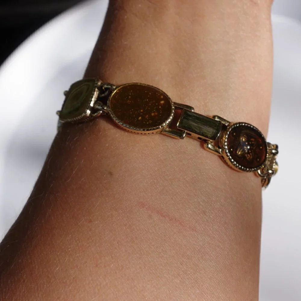 Women`s gold tone green/yellow panel bracelet